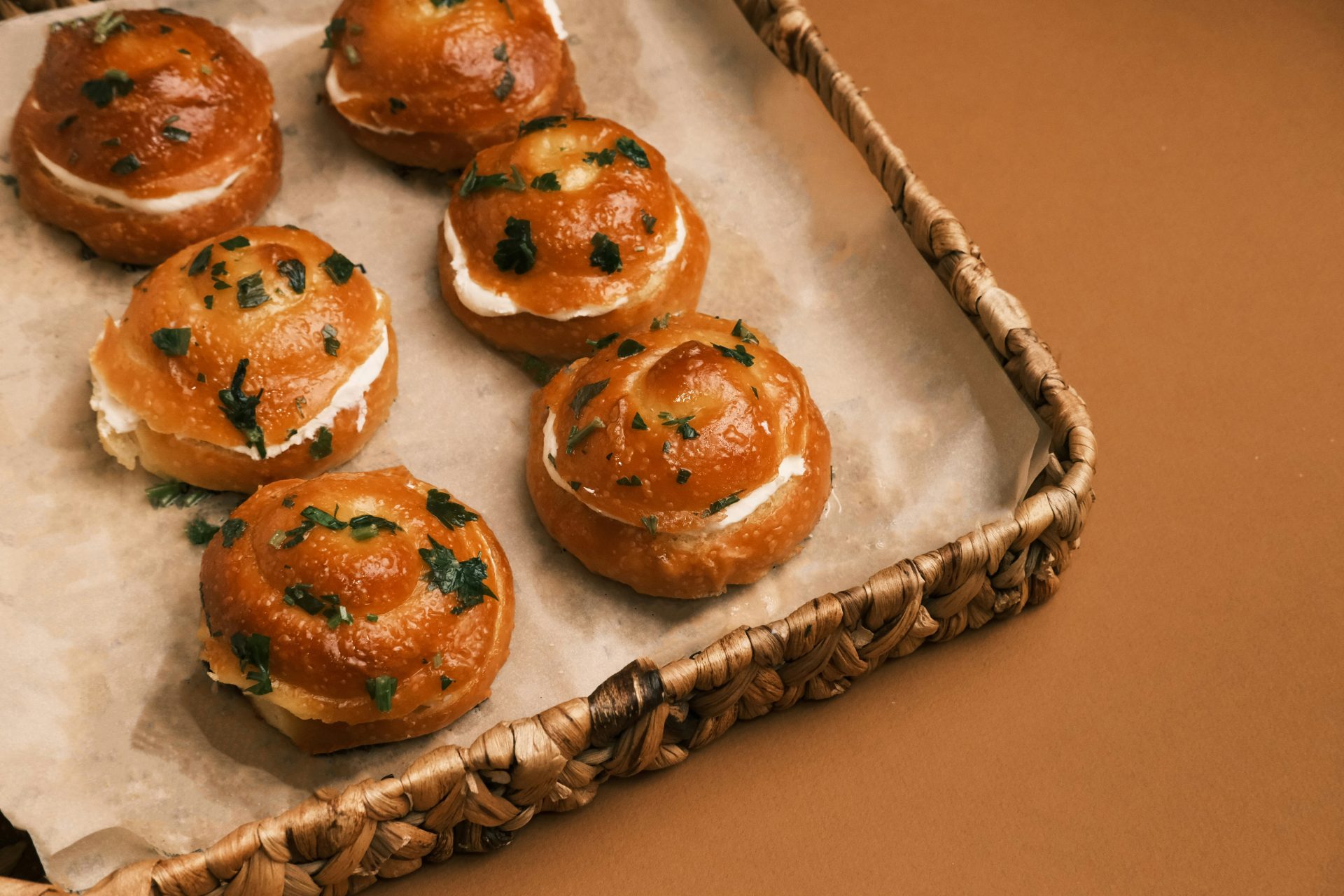 A basket filled with small pastries sitting on top of a table